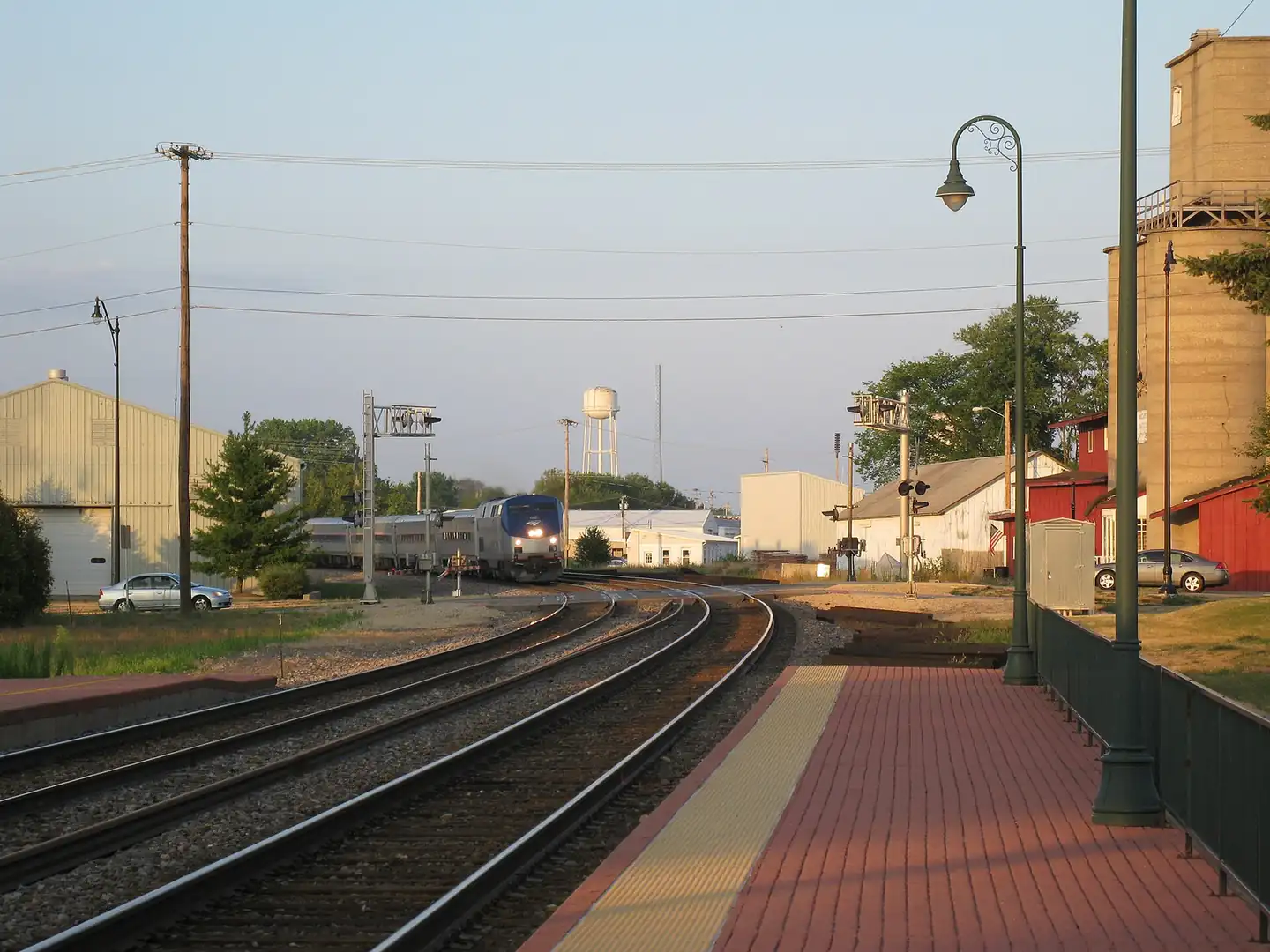 An Amtrak train arriving at a small station in Illinois.