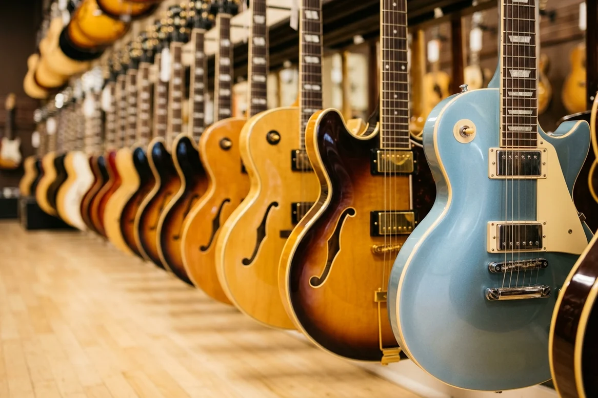 A long row of electric guitars for sale in a Memphis guitar shop.