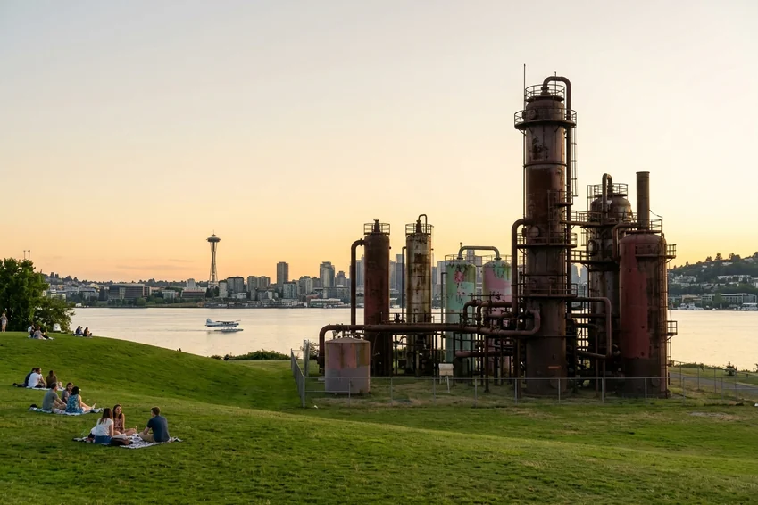 Gas Works Park in Seattle at sunset, the old plant towers and the Space Needle beyond.