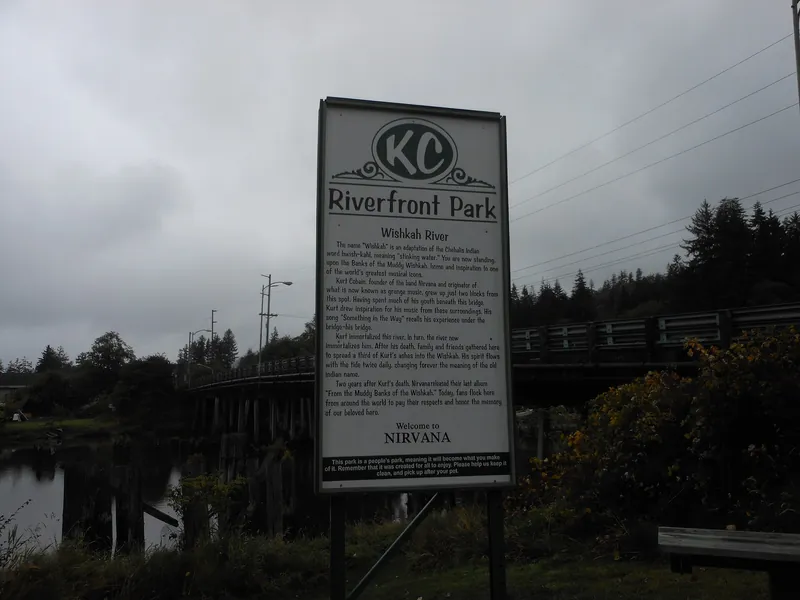 The Kurt Cobain Riverfront Park sign about Nirvana beside the Wishkah River in Aberdeen, Washington.