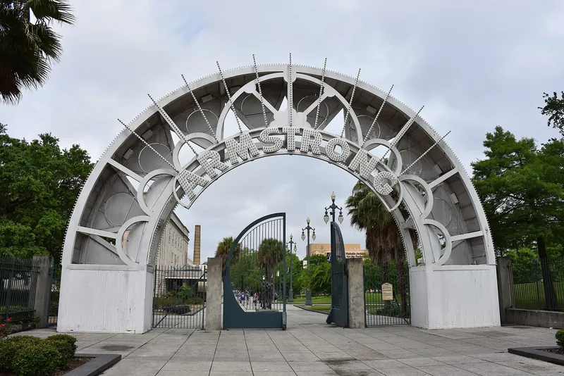 The white Armstrong arch at Louis Armstrong Park, beside Congo Square in New Orleans.