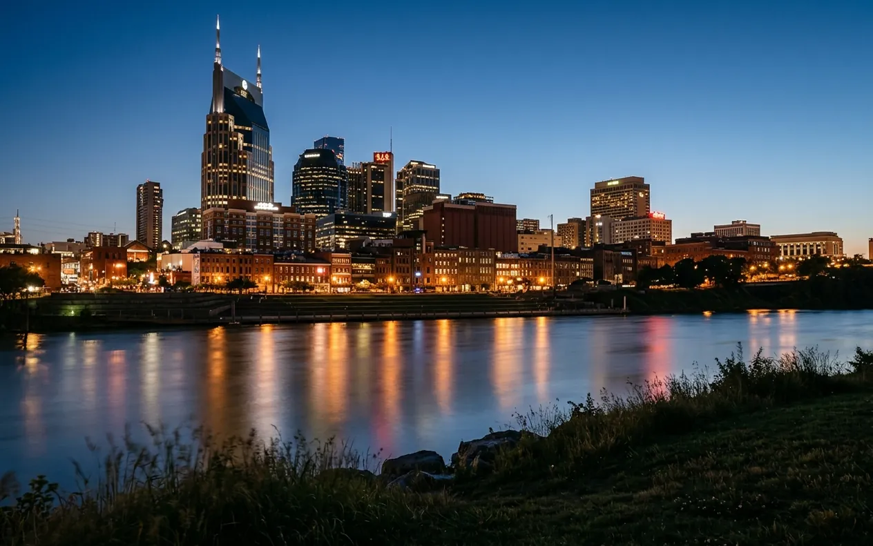 The Nashville skyline at night reflected in the Cumberland River.